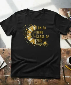 Black t-shirt with yellow text "I AM SO DONG CLASS OF 2019 SENIOR YEAR SURVIVOR" and a sunflower graphic