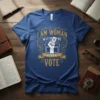 I Am Woman Watch Me Vote VOTE t-shirt design with gold vintage borders and a fist holding a ballot paper