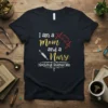 I am a Mom and a Nurse Nothing Scares Me quote with stethoscope and heart graphic on a black t-shirt