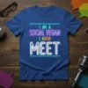 I Am A Social Vegan I Avoid Meet text design in neon style on a blue t-shirt