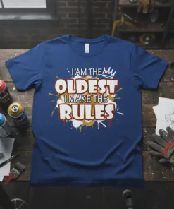 T-shirt with text "I AM THE OLDEST I MAKE THE RULES" in bold white and red font, with a crown