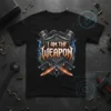 I Am The Weapon quote on a black t-shirt with metallic font, crossed swords, and piston graphics