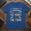 I BECAME A TEACHER FOR THE MONEY AND THE FAME quote on a blue t-shirt with apple and paper airplane