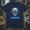I Believe. text with glowing blue circuitry alien head graphic on a navy blue t-shirt