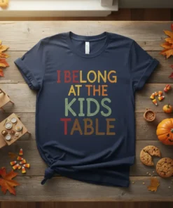 I Belong At The Kids Table text design in colorful, retro font on a navy t-shirt, with a Thanksgiving theme
