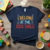 I Belong At The Kids Table text design with playful fonts and graphics on a navy t-shirt