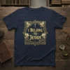 Christian t-shirt with the phrase "I Belong To Jesus" in ornate gold lettering, surrounded by doves and crosses
