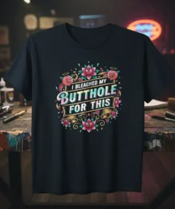 I Bleached My Butthole For This quote on a black t-shirt with floral and peach graphics