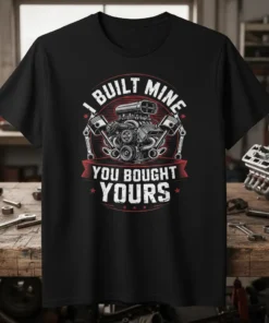 I Built Mine You Bought Yours t-shirt featuring a graphic of a car engine with pistons and text