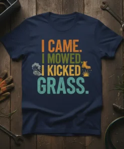 I Came I Mowed I Kicked Grass text design with lawn mower and boot graphics on a navy t-shirt