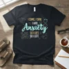 Black t-shirt with the quote "I Came. I Saw. I Had Anxiety So I Left. So I Left." in neon