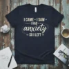 Navy t-shirt with white text "I CAME I SAW I HAD anxiety SO I LEFT" in a distressed, humorous font