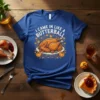 T-shirt with "I Came In Like A Butterball" text and a cartoon roasted turkey graphic surrounded by autumn leaves and