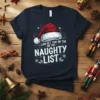 Navy t-shirt with "I Can Get You On The Naughty List" text in white and green, featuring a Santa hat