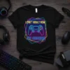 Black t-shirt with neon text "I Can't Adult Now I'm Gaming" and a video game controller graphic
