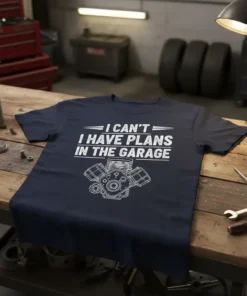 I Can't Have Plans In The Garage T-Shirt featuring a detailed engine graphic and bold white text for mechanics and