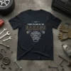 Black t-shirt with text "- I Can't - I Have Plans In The Garage" and a detailed engine graphic