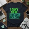 I Can't I'm In Nursing School text design with green circuit board style font on a navy t-shirt