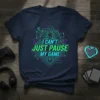 I CAN'T JUST PAUSE MY GAME text with neon green and purple circuit board graphic on a navy t-shirt