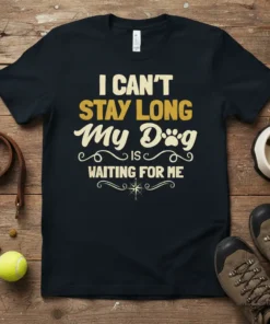 I CAN'T STAY LONG My Dog IS WAITING FOR ME text design on a black t-shirt, featuring paw print graphic
