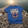 Blue t-shirt with "I CAN'T SWIM" text and a red life preserver graphic with small fish