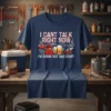 I Can't Talk Right Now I'm Doing Hot Dad Stuff t-shirt with grill, beer, and lawnmower graphics