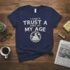 I Can't Trust A Fart At My Age humorous quote on a navy t-shirt with a vintage illustration of an