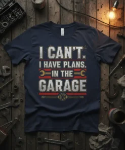 T-shirt with text "I Can't. I Have Plans. In The Garage" in bold typography and garage-themed graphics