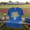 Blue t-shirt with "I CHEER FOR THE WATERBOY" text and a cartoon water jug character graphic