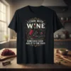 I Cook With Wine Sometimes I Even Add It To The Food quote on a black t-shirt, featuring a wine