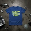Blue t-shirt with yellow text "I Crash Cars" and graphic of two cars colliding, for mechanic humor