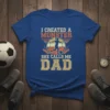 I Created A Monster She Calls Me Dad text with soccer player graphic and cleats on a blue t-shirt