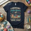 T-shirt with the quote "I Crochet So I Don't Choke People Save A Life Send Yarn" and a cartoon cat