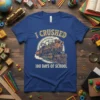 Blue t-shirt with "I CRUSHED 100 DAYS OF SCHOOL" text and a vintage steam train graphic, perfect for 100th day