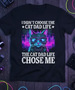 I Didn't Choose The Cat Dad Life text with a cool cat wearing sunglasses and a cityscape background, on a