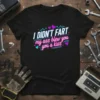 T-shirt with the bold text "I DIDN'T FART my ass blew you a kiss" in neon pink and blue font