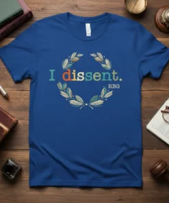Blue t-shirt with "I dissent. RBG." text in colorful font within a laurel wreath graphic