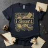 Dark navy t-shirt with a vintage gold graphic that says "i dissent." surrounded by gears, books, and scrolls