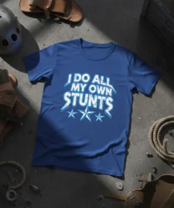 Blue t-shirt with white distressed text "I DO ALL MY OWN STUNTS" and three blue stars below