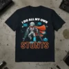 Robot with crutches and cast wearing a cape, text says "I Do All My Own Stunts" on a black t-shirt