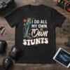 Skeleton graphic t-shirt with the text "I Do All My Own Stunts" in retro font, surrounded by flowers