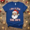 I Do It For The Ho's funny Christmas t-shirt with a cartoon Santa Claus graphic and festive text