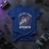 I Do My Own Stunts text and bandaged hand graphic on a royal blue t-shirt
