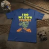 I Do My Own Stunts motocross rider graphic tee in yellow and orange on a navy blue t-shirt