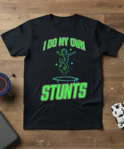 Black t-shirt with neon green text "I Do My Own Stunts" and a graphic of a person jumping on a