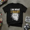 Black t-shirt with white and gold text "I DO WHAT I WANT" above a white cat giving the middle finger