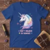 White unicorn with rainbow mane and "I Don't Believe In Humans" text on a blue t-shirt, surrounded by stars
