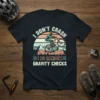T-shirt with the text "I DON'T CRASH I DO RANDOM GRAVITY CHECKS" featuring a mountain biker mid-air