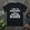Black t-shirt with white text "I DON'T DO MARATHONS I DO A MARATHON RUNNER" and a graphic of a runner