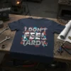 Navy blue t-shirt with bold silver text "i DON'T FEEL TARDY." surrounded by orange and blue gear graphics and geometric
